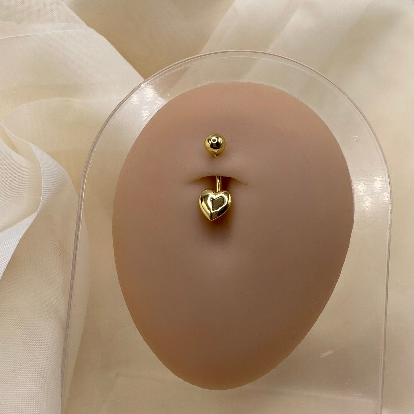 Gold Heart Belly Bar Piercing