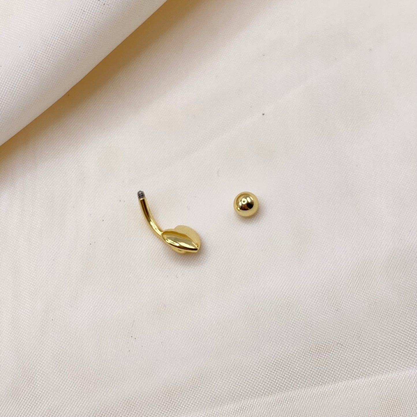 Gold Heart Belly Bar Piercing